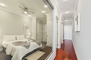 Spacious bedroom with a Queen-sized bed and contemporary design, offering ultimate comfort