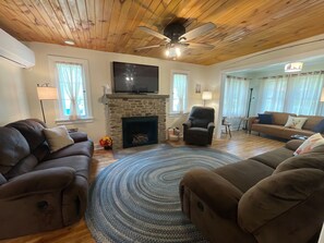 You'll relax with fully reclining couches, ceiling fan, gas log firepl, Roku TV
