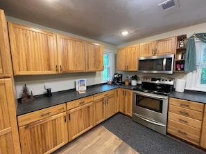 Fully stocked Kitchen! Includes k-cups, tea bags, spices & baking supplies.