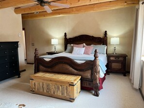 Framed king bed and chest in the main bedroom