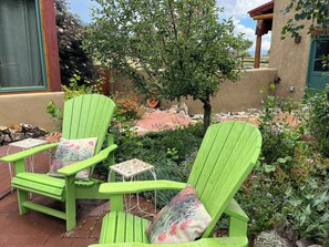 Adirondack lounge chairs in the garden courtyard.