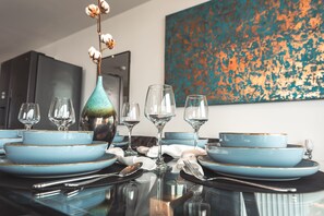  Enjoy dining at our six-seater table while sipping fine wine during sunset.