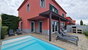 Indulge in ultimate relaxation at The Red Hot Chill House. Lounge by the sparkling pool on comfortable sun loungers, soaking up the sun with stunning ocean and mountain views as your backdrop.