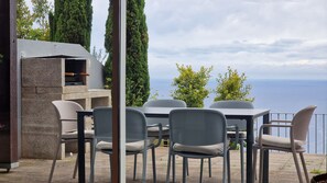 Experience outdoor dining at The Red Hot Chill House with stylish furniture and a BBQ area. Enjoy delightful meals under the open sky, surrounded by breathtaking ocean and mountain views. #outdoorfurniture #bbq