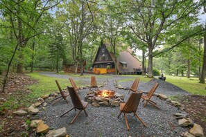 Firepit out back with plenty of firewood. S’mores not included.