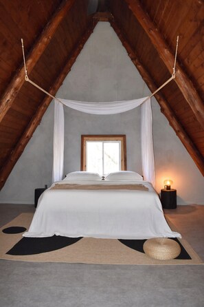 Sleep like a royal family member on the king-size bed in the loft bedroom.
