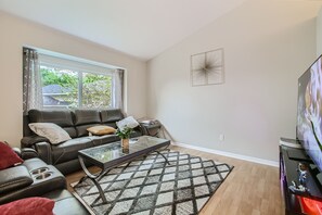 Living room with plush reclining chairs for the perfect movie night