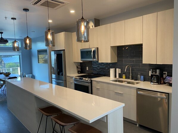 Modern Open Kitchen with modern appliances, and large center island
