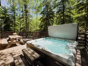 Private deck with hot tub and outdoor seating