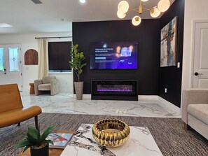 75+ " Roku TV, sofa sleeper sectional and fireplace