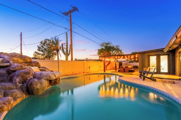 Pool with water features and slide