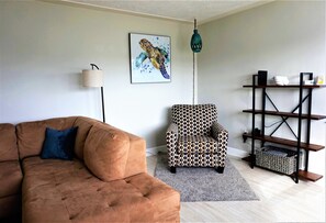 Relax in the reading area in the back of the living room