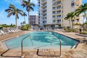 The community pool and sundeck provide a place to cool off from the beach, sunbathe, or enjoy the company of fellow vacationers.