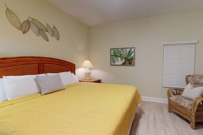 King size bed in primary bedroom with ensuite bathroom