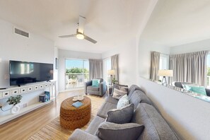 Comfortable Living Room, with Direct Access to Balcony, Large TV, and Premium Queen Size Sleep Sofa