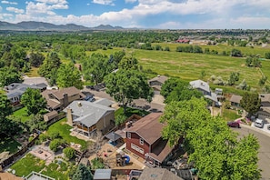 The drone captures a breathtaking scene with a majestic mountain range stretching across the horizon, offering a stunning backdrop that enhances the natural beauty of the surroundings.