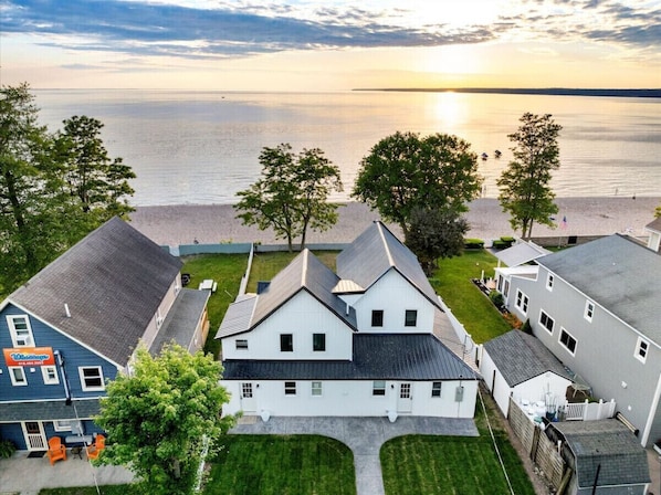 Exterior shot of the property, showcasing its architectural style and landscaped surroundings.