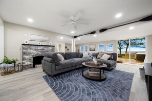 Modern living space with a sliding glass door leading to a balcony, offering a tranquil escape and natural light.