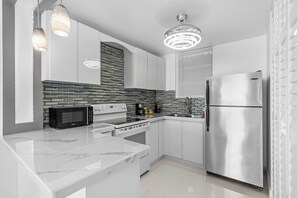 The fully equipped kitchen is perfect for an extended stay.
