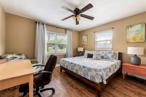 King bed with a desk for work space. 