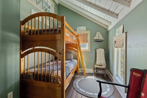 Bunk bed dreams in a cozy attic nook. Perfect for adventures and sleepovers!