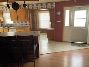 View from dining room towards kitchen and small office.