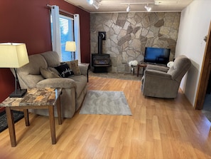 Living room with gas fireplace and smart TV. Wi-Fi Internet also available.