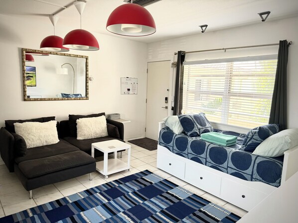 Cute L-sofa that seats 2 comfortably. Twin day-bed that opens up to a king size.