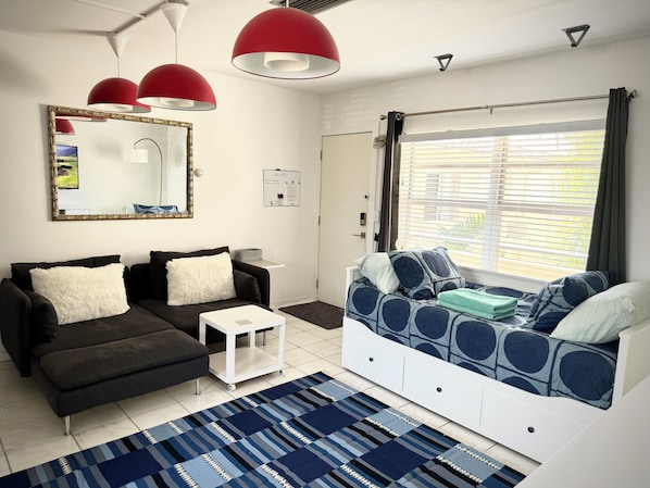 Cute L-sofa that seats 2 comfortably. Twin day-bed that opens up to a king size.
