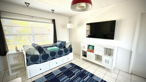  Twin day-bed that opens up to a king size. 50in smart TV with streaming network