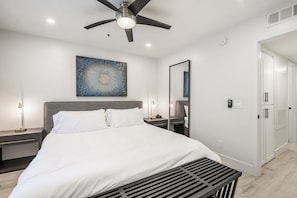 King bedroom with walking closet through mirror