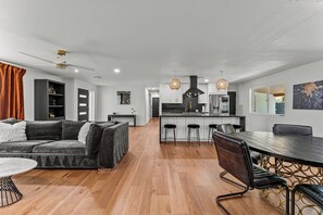 Welcome to the heart of our stylish retreat! Our living room exudes comfort and modern charm, featuring plush furnishings and contemporary decor. 