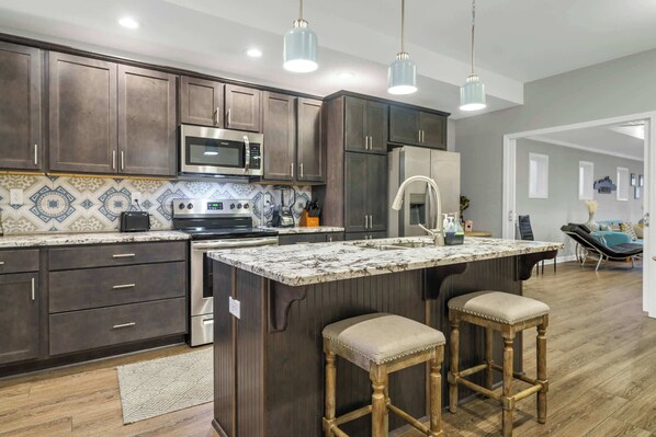Kitchen: Experience the perfect blend of functionality and style with the kitchen opening up to the living area, keeping everyone connected.