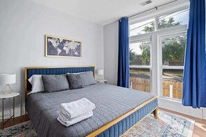 Bedroom 2: The upstairs queen bed has its own air conditioning unit for year-round comfort.