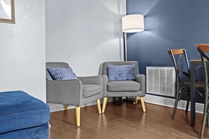 Living Room: Chic, comfortable, and filled with natural light — the perfect space to unwind or catch up on your favorite shows