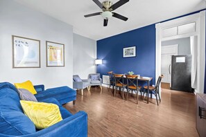 Living Room: Chic, comfortable, and filled with natural light — the perfect space to unwind or catch up on your favorite shows