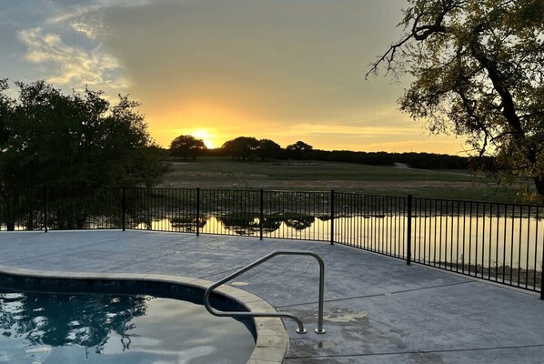 Community pool view at sunset