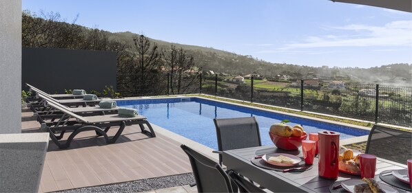 The Experience Of Outdoor Dining Overlooking The Pool And The Rolling Countryside Hills Around Vistaserena Villa In Madeira By Ourmadeira