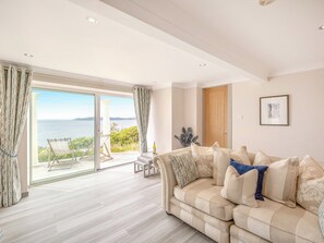 Living area with 65 inch OLED TV and sky package  | Crownhill Bay Garden Suite - Crownhill Bay House, Down Thomas, near Plymouth