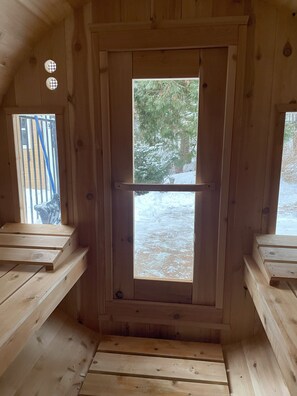 Cozy sauna with nature views—stay warm and relaxed 