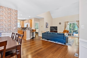 An open layout connecting living, dining, and kitchen areas for seamless relaxation and entertaining.