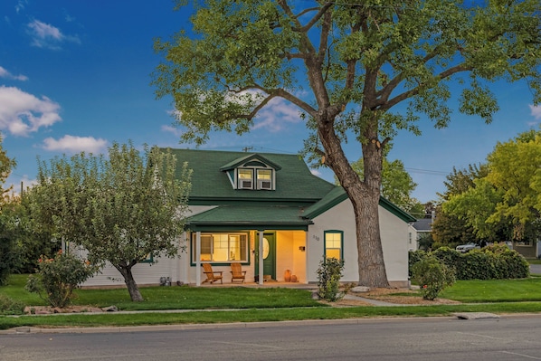 Exterior of home, large shade tree, grass yard, quiet and safe neighborhood.