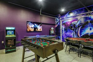 Game room fulled with arcade games, air hockey table, foosball table, pool table and poker table for you to enjoy during your stay with us!