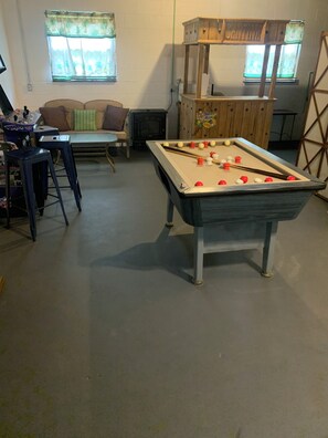 Let the kids enjoy an old school game of bumper pool and you enjoy the tiki bar