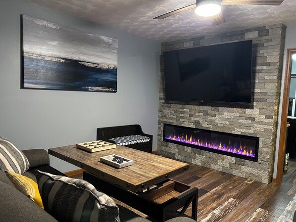 Flex steel sleeper sofa, fireplace, 75in smart tv, recliner heated throw