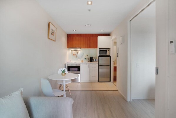 View of the open-plan space that includes the lounge, dining and kitchen.