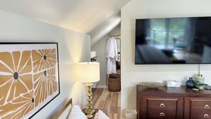 65" HD Smart TV with Fast Wifi. Walk-in closet with a full-length mirror.