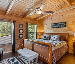 Cozy pet-friendly cabin near Pigeon Forge with hot tub, perfect for a romantic getaway. Features a king bed, rustic wood walls, and scenic views—ideal for couples seeking a peaceful retreat near top attractions in the Smoky Mountains.