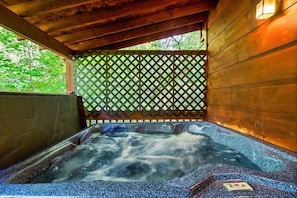Escape the hustle and bustle as you soak in the warmth of this inviting hot tub tucked away in a covered space, shielded by a rustic wooden fence. 🛁🌲 #PrivateOasis #SereneRetreat #HomeSpa