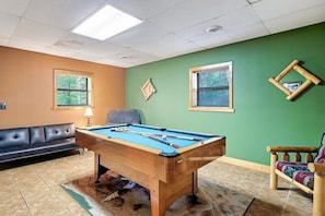 The ultimate entertainment zone with this stylish living room featuring a pool table and a cozy couch 🎱🛋️ #EntertainmentZone #GameNight #CozyVibes